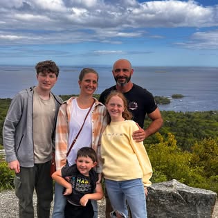 Mike Ross, owner of Emerald Lawn & Turf, with his family