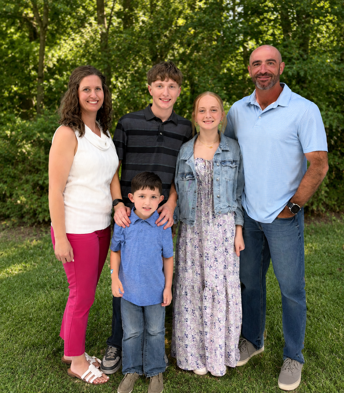 Mike Ross, owner of Emerald Lawn & Turf, with his family